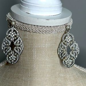 Silver earrings.